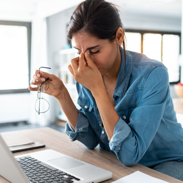 woman stressed looking at laptop